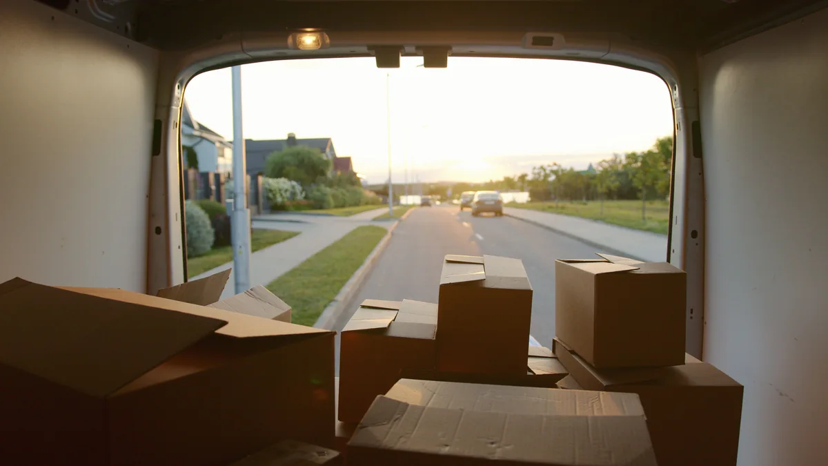 Cardboard boxes arranged inside a cargo van